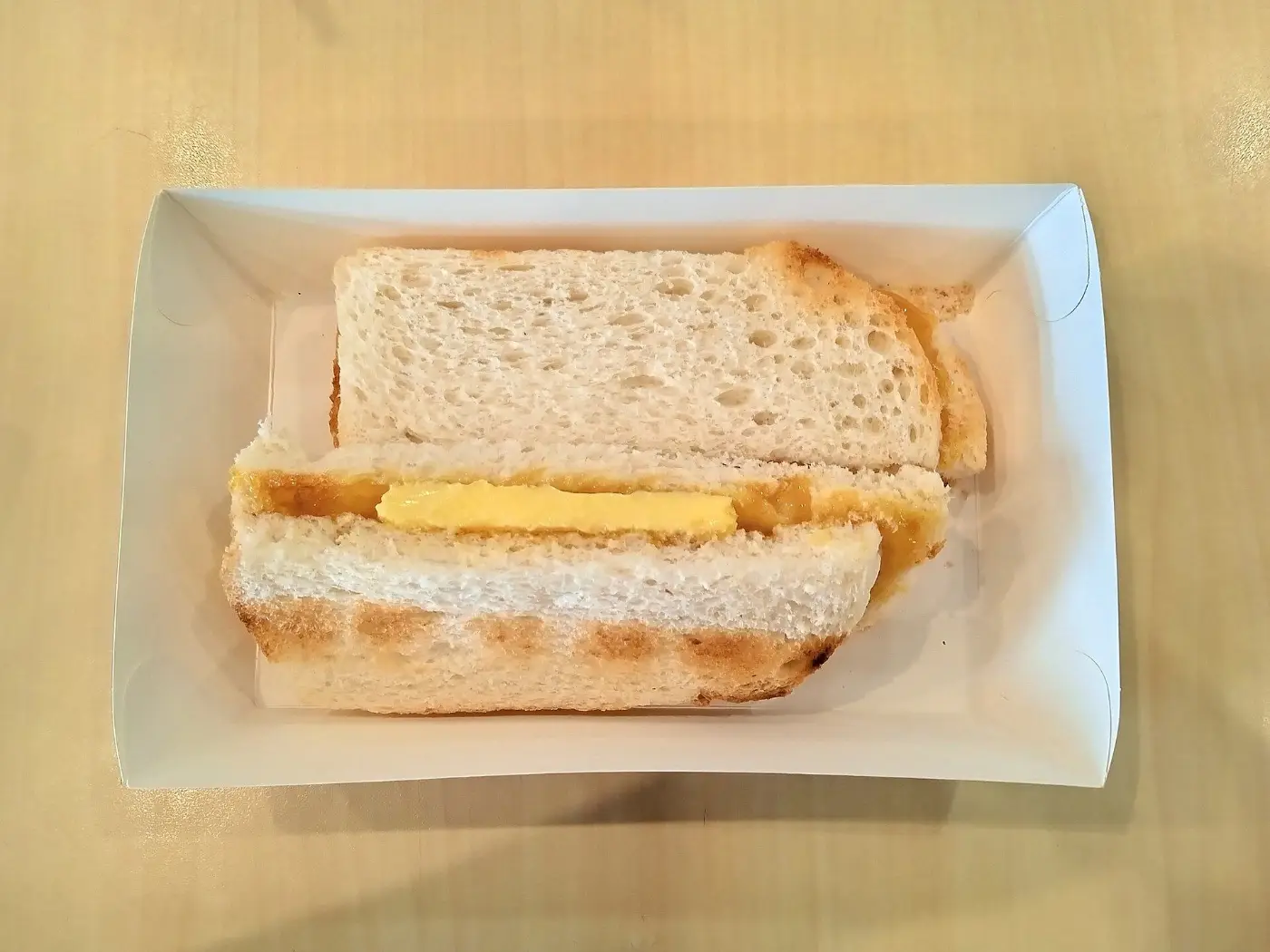 Kaya and butter toast sandwiches on a plate
