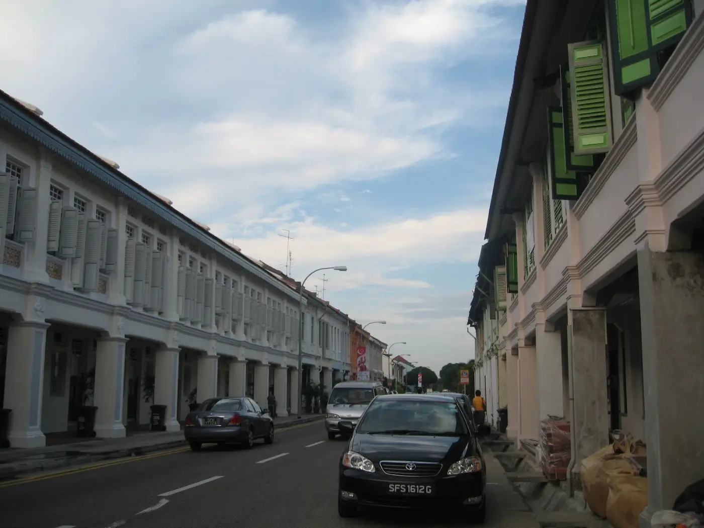 A row of pastel shophouses along a Joo Chiat street