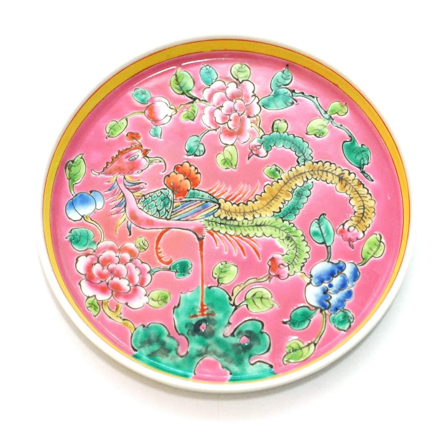 A pink Straits Chinese porcelain plate painted with a phoenix and peonies